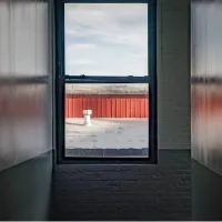 Looking through the window. 