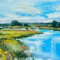 Blue lake & green, flowered shore.