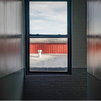 Looking through the window. 