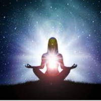 A woman sitting within light.